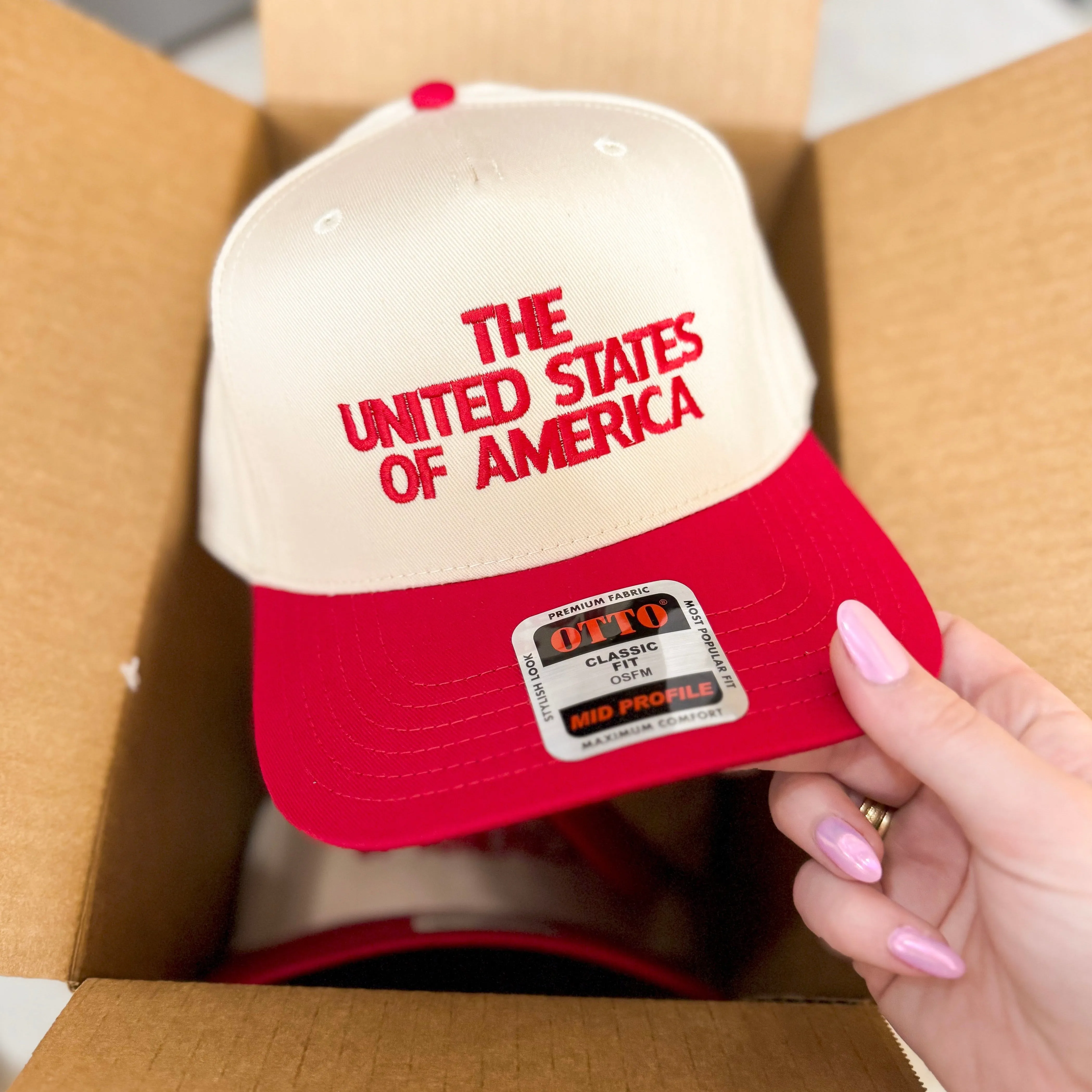 The United State of America Trucker Hat in Cream and Red